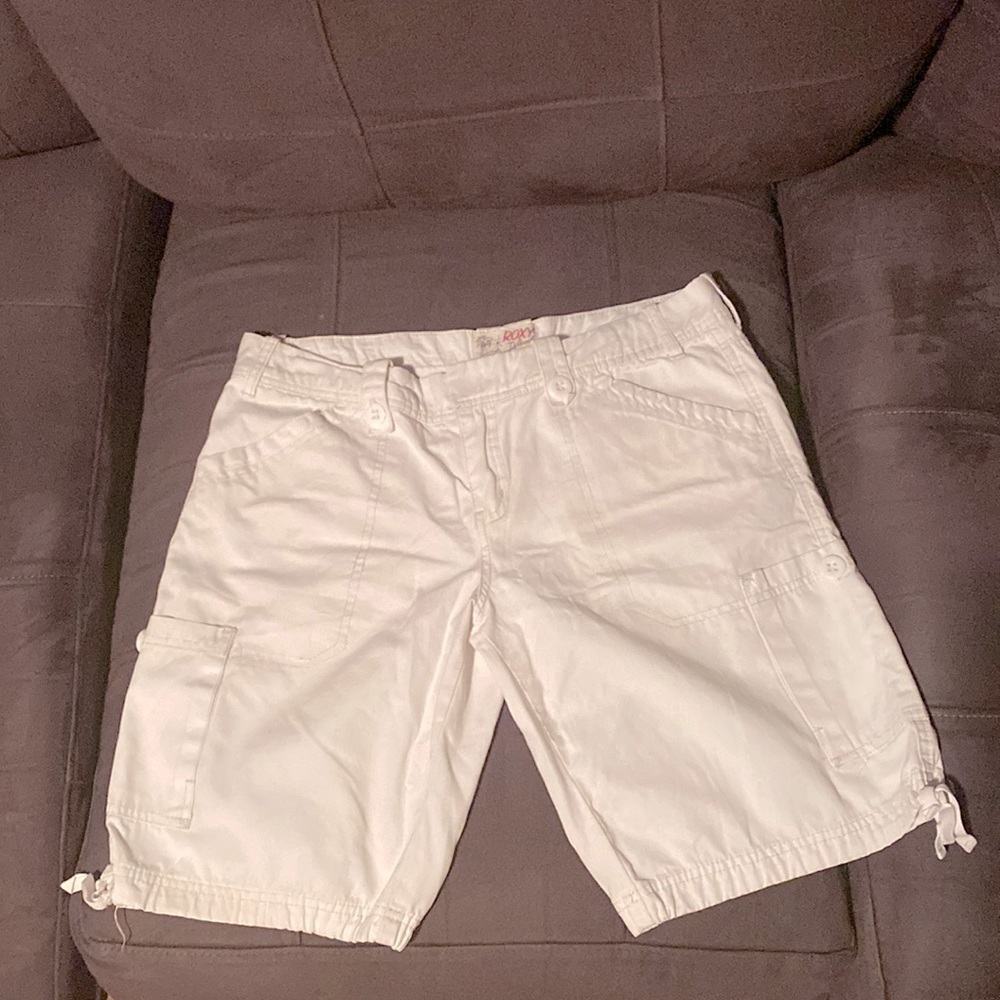 White shorts with 4 pockets on the front.